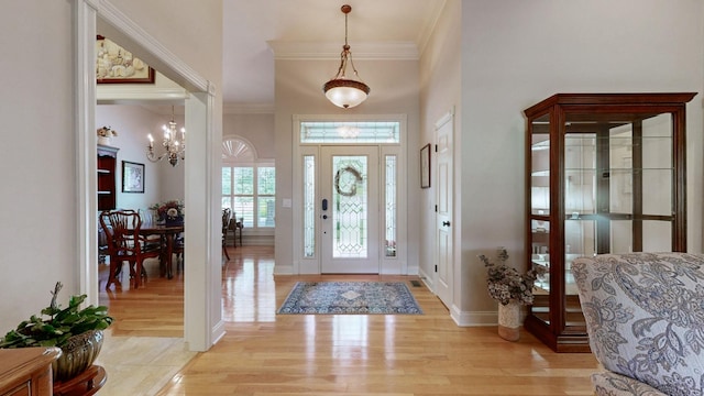 516 Letcher Ave, Lebanon, TN 37087 - foyer entrance with crown molding, a chandelier, light wood-style floors, and baseboards