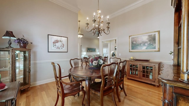 516 Letcher Ave, Lebanon, TN 37087 - dining area featuring ornamental molding, light wood finished floors, a chandelier, and baseboards