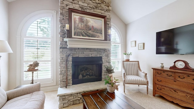 516 Letcher Ave, Lebanon, TN 37087 - living room featuring a stone fireplace, healthy amount of natural light, lofted ceiling, and tile patterned flooring