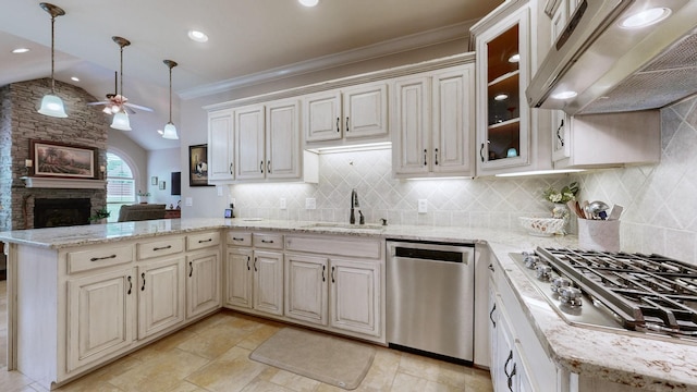 516 Letcher Ave, Lebanon, TN 37087 - kitchen with stainless steel appliances, wall chimney range hood, a sink, a ceiling fan, and a stone fireplace