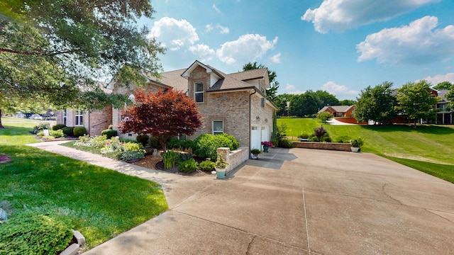 516 Letcher Ave, Lebanon, TN 37087 - view of front of house featuring driveway, brick siding, a front lawn, and a garage