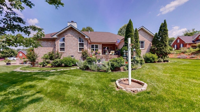 516 Letcher Ave, Lebanon, TN 37087 - rear view of property featuring brick siding, a chimney, and a lawn