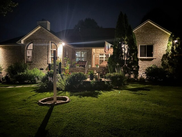 516 Letcher Ave, Lebanon, TN 37087 - single story home with a lawn, a chimney, and brick siding