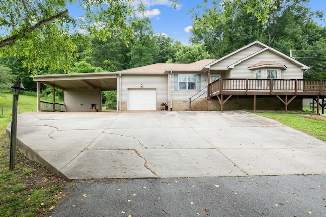 97 Whitefield Ln, Carthage, TN 37030 - view of front of home featuring an attached garage, concrete driveway, a deck, and a carport