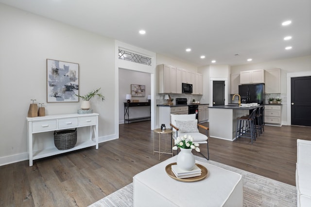 312 N Main St, Dickson, TN 37055 - living area with dark wood-type flooring, recessed lighting, and baseboards