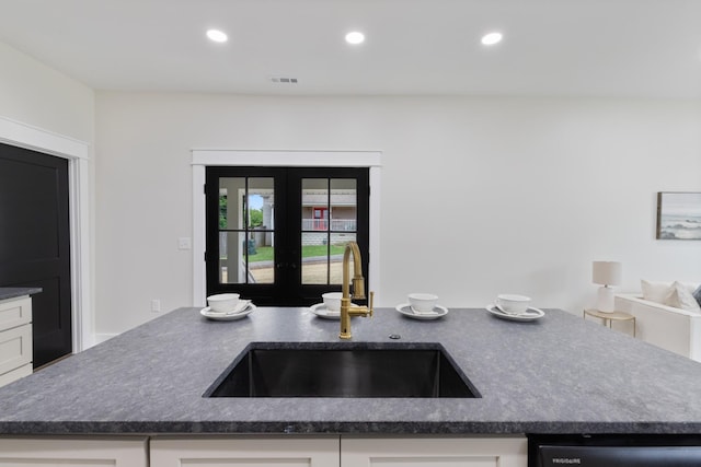 312 N Main St, Dickson, TN 37055 - kitchen featuring a sink, dishwasher, french doors, recessed lighting, and white cabinetry