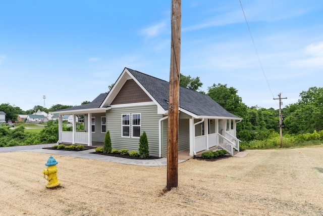 312 N Main St, Dickson, TN 37055 - view of front of house featuring covered porch and roof with shingles