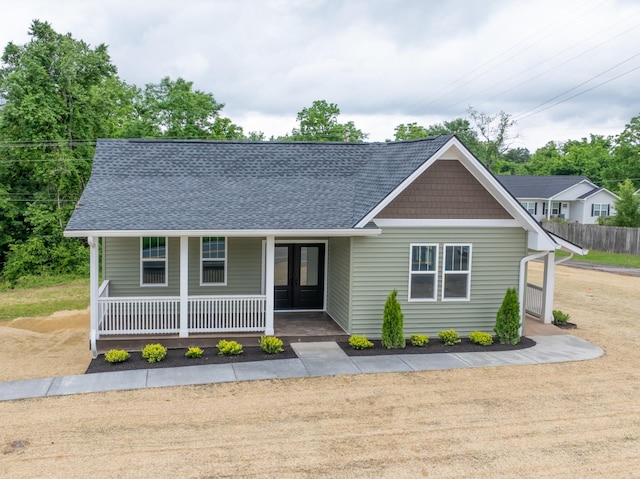 312 N Main St, Dickson, TN 37055 - view of front of house featuring covered porch and roof with shingles