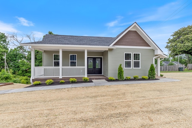 312 N Main St, Dickson, TN 37055 - view of front of house with french doors, a shingled roof, and covered porch