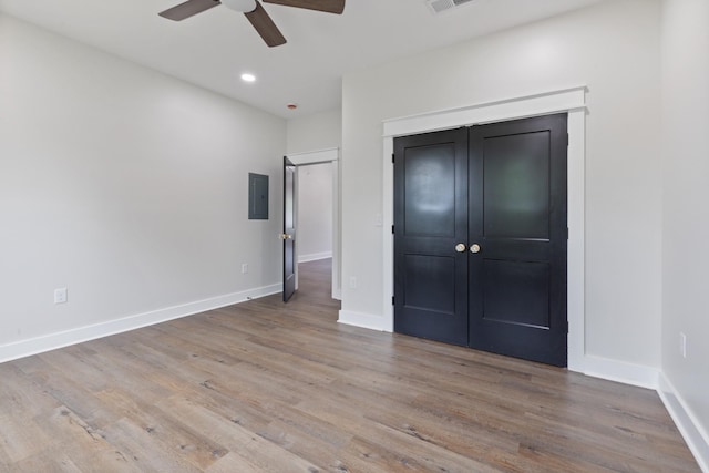 312 N Main St, Dickson, TN 37055 - unfurnished bedroom with electric panel, wood finished floors, baseboards, and recessed lighting