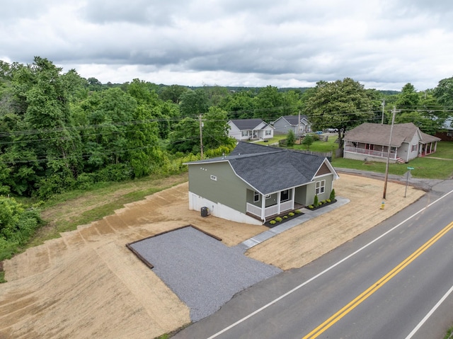 312 N Main St, Dickson, TN 37055 - aerial view of property and surrounding area featuring a heavily wooded area