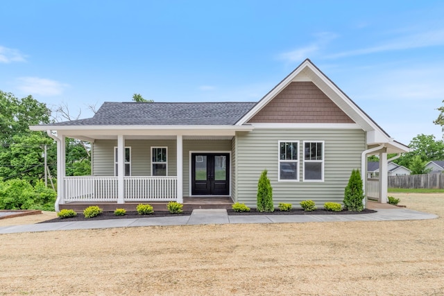 312 N Main St, Dickson, TN 37055 - view of front of house with french doors, covered porch, and a shingled roof