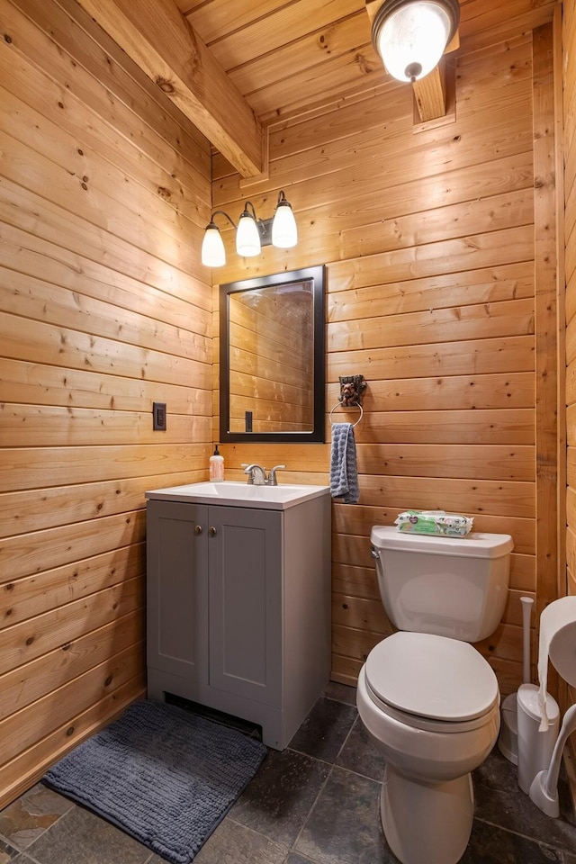 2223 Simmons Ridge Rd, Cornersville, TN 37047 - half bathroom with toilet, vanity, wooden walls, stone tile floors, and wood ceiling with exposed beams