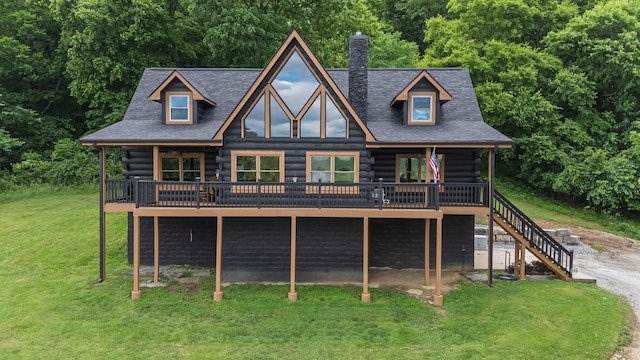 2223 Simmons Ridge Rd, Cornersville, TN 37047 - view of front of house featuring log siding, a wooden deck, a chimney, and a front lawn