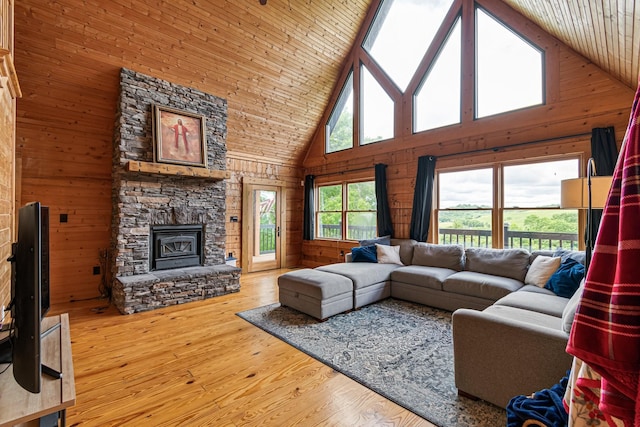 2223 Simmons Ridge Rd, Cornersville, TN 37047 - living area with high vaulted ceiling, wood walls, wood finished floors, a fireplace, and wooden ceiling