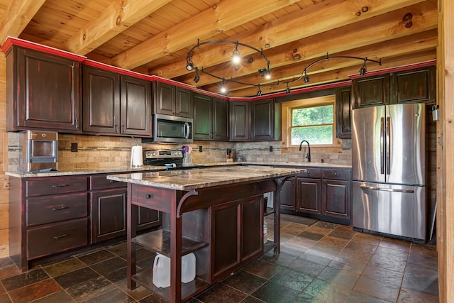 2223 Simmons Ridge Rd, Cornersville, TN 37047 - kitchen with stainless steel appliances, stone tile flooring, wooden ceiling with exposed beams, backsplash, and a breakfast bar area