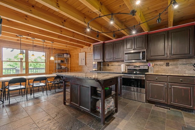 2223 Simmons Ridge Rd, Cornersville, TN 37047 - kitchen featuring stainless steel appliances, wood ceiling with exposed beams, stone tile flooring, light stone counters, and decorative backsplash