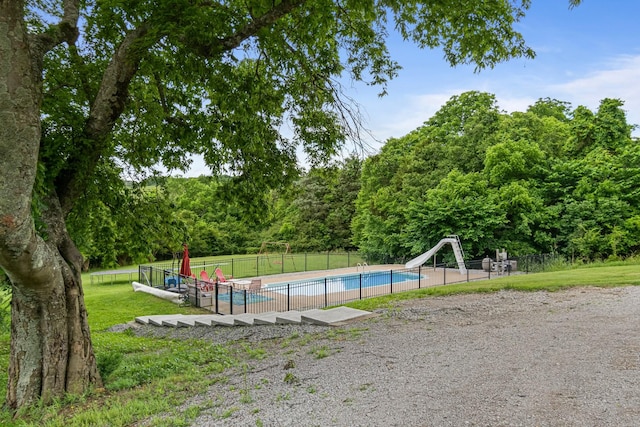 2223 Simmons Ridge Rd, Cornersville, TN 37047 - view of swimming pool with a water slide and a wooded view
