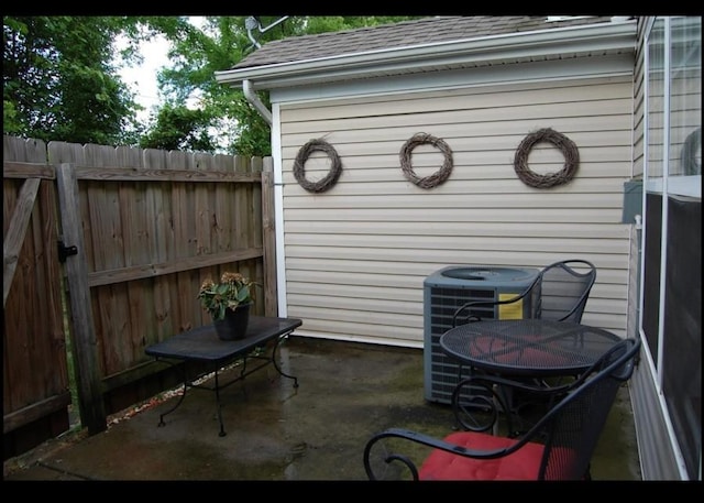 4050 George Buchanan Dr, La Vergne, TN 37086 - view of patio featuring central AC unit