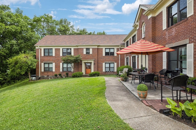 511 Jones St Unit C3, Old Hickory, TN 37138 - view of front of home featuring brick siding, a front lawn, and a patio area