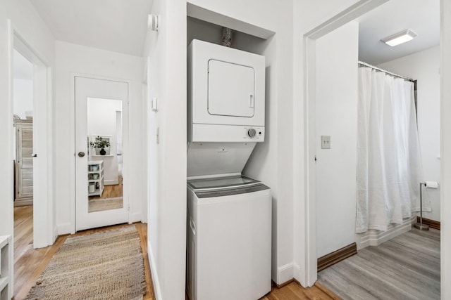511 Jones St Unit C3, Old Hickory, TN 37138 - laundry area featuring stacked washer and clothes dryer, light wood finished floors, and baseboards