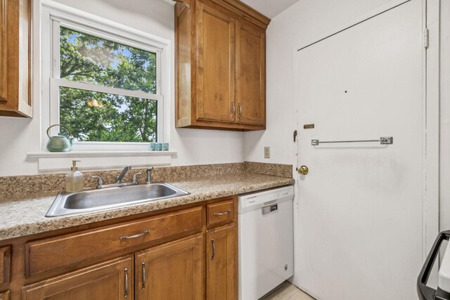 511 Jones St Unit C3, Old Hickory, TN 37138 - kitchen with white dishwasher, a sink, brown cabinetry, and light countertops