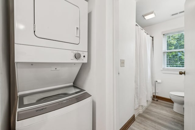 511 Jones St Unit C3, Old Hickory, TN 37138 - laundry area featuring stacked washing machine and dryer, baseboards, and light wood-style floors