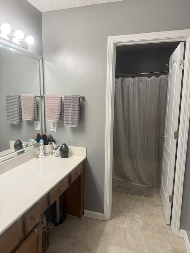 284 Meigs Dr Unit C19, Murfreesboro, TN 37128 - bathroom with vanity, a shower with curtain, baseboards, and tile patterned flooring