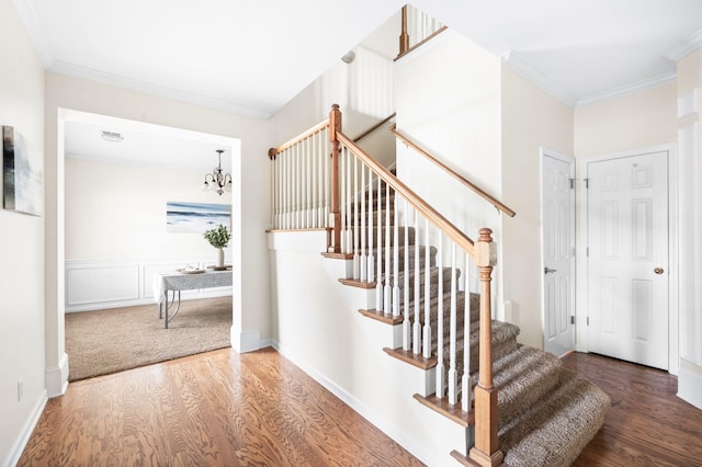 3113 Friars Bridge Pass, Franklin, TN 37064 - stairway featuring wood finished floors, ornamental molding, and a chandelier