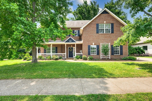 3113 Friars Bridge Pass, Franklin, TN 37064 - view of front of property featuring a porch, brick siding, and a front lawn