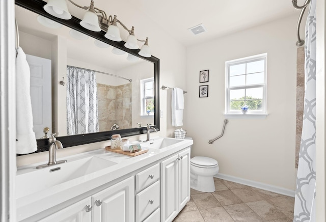 3113 Friars Bridge Pass, Franklin, TN 37064 - full bath with double vanity, toilet, a shower with shower curtain, tile patterned flooring, and baseboards
