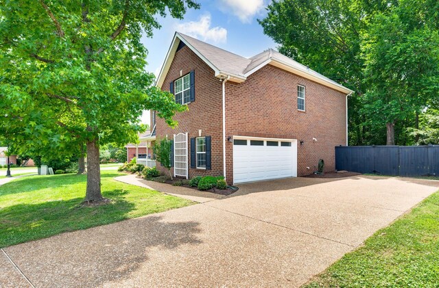 3113 Friars Bridge Pass, Franklin, TN 37064 - view of property exterior with concrete driveway, brick siding, and a garage
