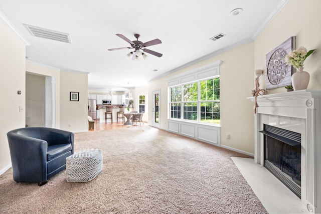 3113 Friars Bridge Pass, Franklin, TN 37064 - carpeted living area featuring ornamental molding, ceiling fan, a fireplace with flush hearth, and baseboards