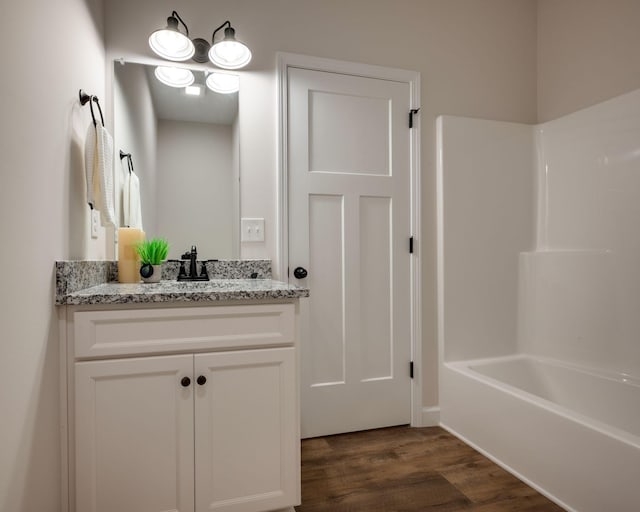 766 Billy Wynn Rd, Dickson, TN 37055 - bathroom featuring vanity, wood finished floors, and bathtub / shower combination