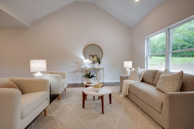 766 Billy Wynn Rd, Dickson, TN 37055 - living room with light wood-type flooring, high vaulted ceiling, and baseboards