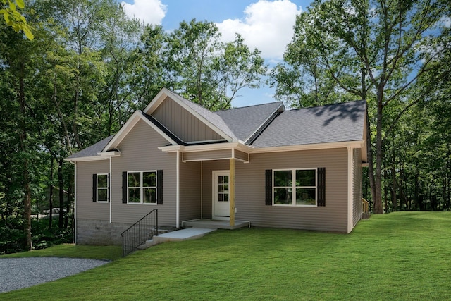 766 Billy Wynn Rd, Dickson, TN 37055 - view of front facade with a front yard, roof with shingles, and board and batten siding