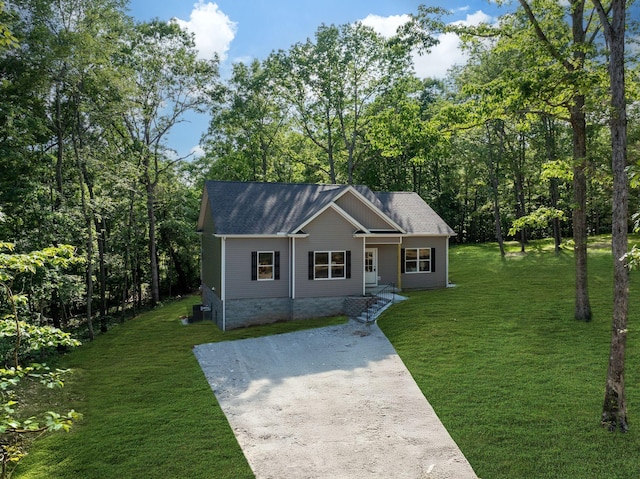 766 Billy Wynn Rd, Dickson, TN 37055 - ranch-style house with a front lawn, cooling unit, and a shingled roof