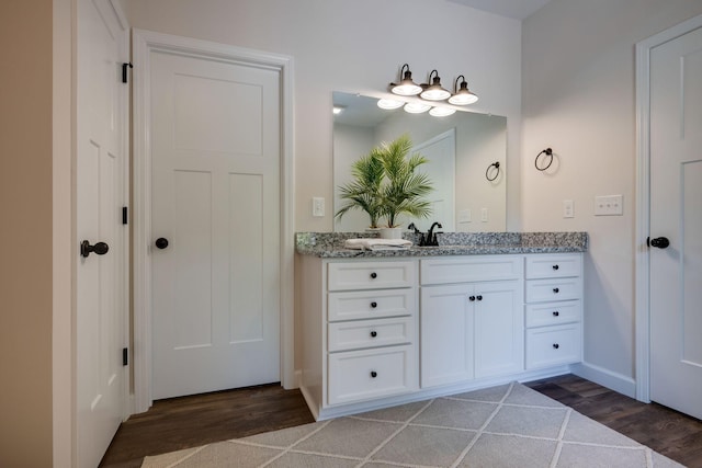 766 Billy Wynn Rd, Dickson, TN 37055 - bathroom featuring vanity, wood finished floors, and baseboards