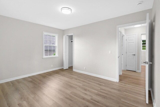 4044 Brick Church Pike, Nashville, TN 37207 - unfurnished bedroom featuring light wood-style flooring and baseboards