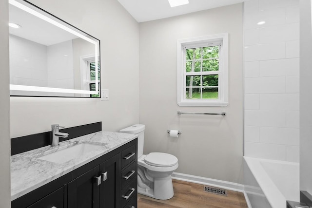 4044 Brick Church Pike, Nashville, TN 37207 - bathroom featuring wood finished floors, vanity, toilet, and baseboards