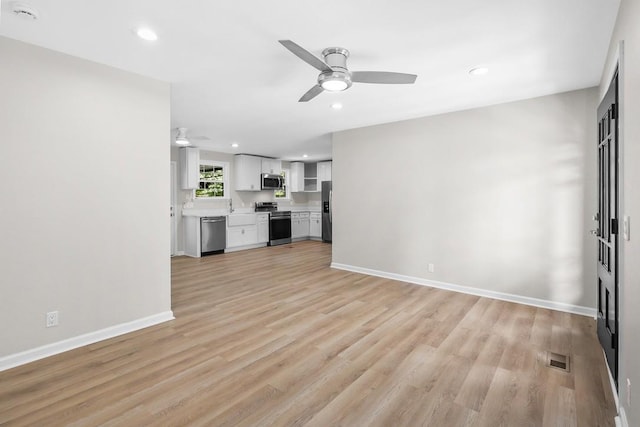 4044 Brick Church Pike, Nashville, TN 37207 - unfurnished living room featuring a ceiling fan, light wood-type flooring, baseboards, and recessed lighting