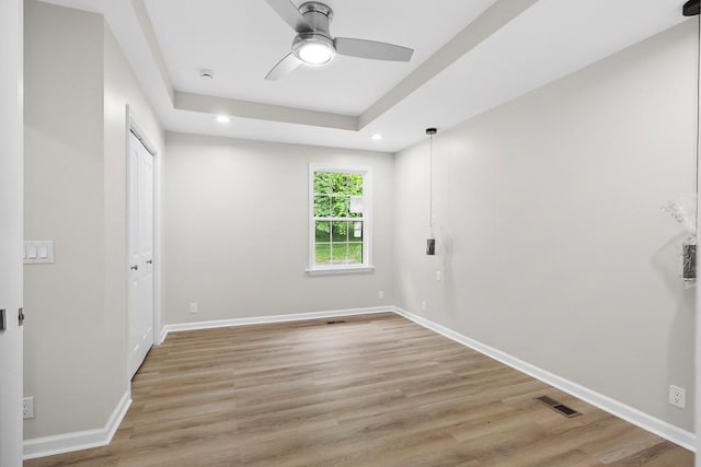 4044 Brick Church Pike, Nashville, TN 37207 - unfurnished bedroom with light wood-style floors, baseboards, recessed lighting, a raised ceiling, and ceiling fan