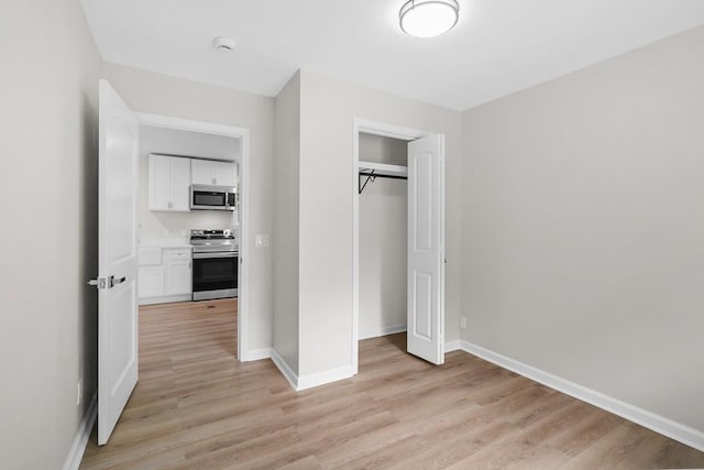4044 Brick Church Pike, Nashville, TN 37207 - unfurnished bedroom with light wood-type flooring, baseboards, and a closet