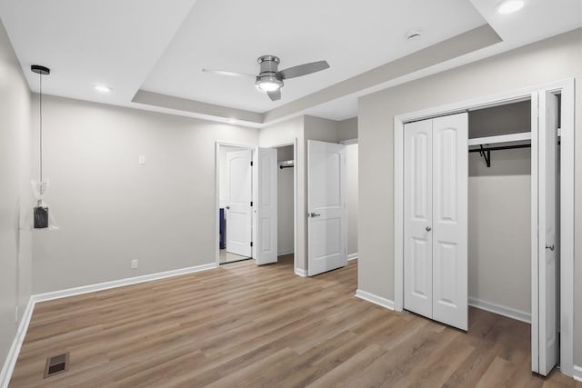 4044 Brick Church Pike, Nashville, TN 37207 - unfurnished bedroom with light wood finished floors, baseboards, recessed lighting, a raised ceiling, and a ceiling fan