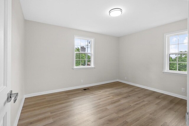 4044 Brick Church Pike, Nashville, TN 37207 - unfurnished room featuring plenty of natural light, wood finished floors, and baseboards
