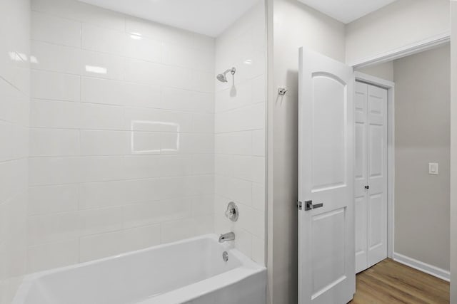 4044 Brick Church Pike, Nashville, TN 37207 - full bath featuring washtub / shower combination, wood finished floors, and baseboards