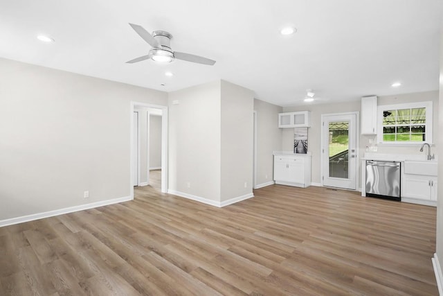 4044 Brick Church Pike, Nashville, TN 37207 - unfurnished living room featuring a ceiling fan, light wood-style flooring, baseboards, recessed lighting, and a sink