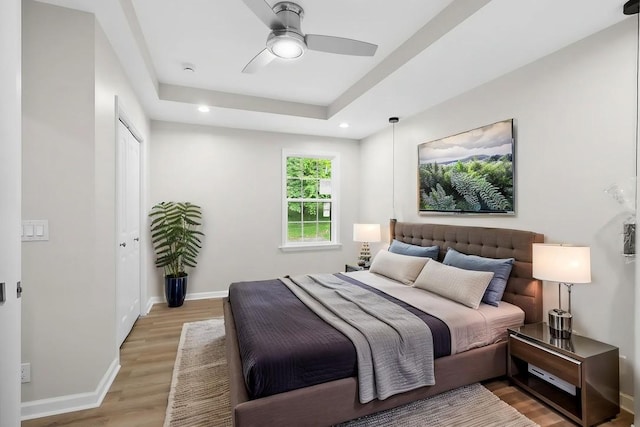4044 Brick Church Pike, Nashville, TN 37207 - bedroom with light wood-style flooring, baseboards, recessed lighting, a raised ceiling, and a closet