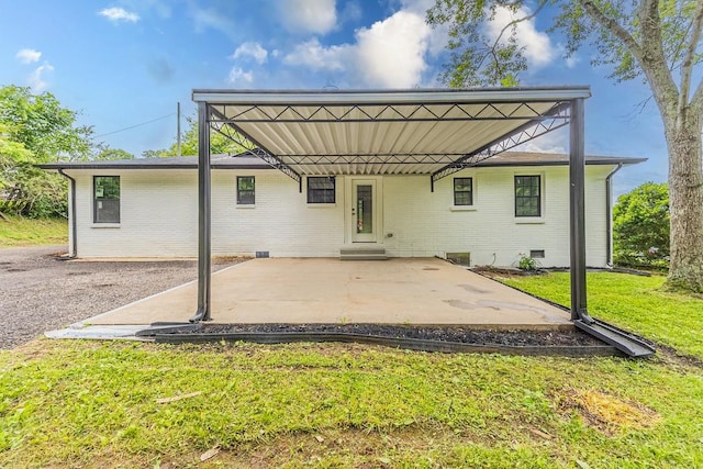 4044 Brick Church Pike, Nashville, TN 37207 - back of property with a lawn, brick siding, a carport, and entry steps