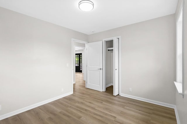 4044 Brick Church Pike, Nashville, TN 37207 - unfurnished bedroom featuring baseboards, wood finished floors, and a closet